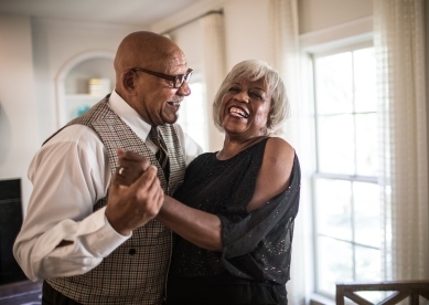 Senior Couple Dancing in Living Room