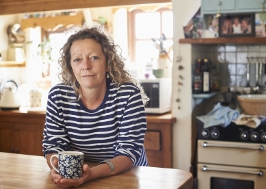 Woman in Kitchen with Mug