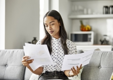 Young Woman Looking at Documents
