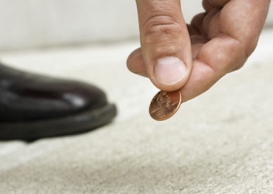 Man Picking Penny Up Off Ground